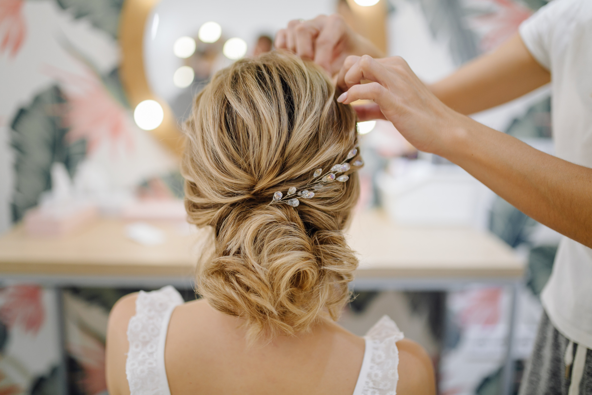 Picture of bride having her hair styled for her wedding day