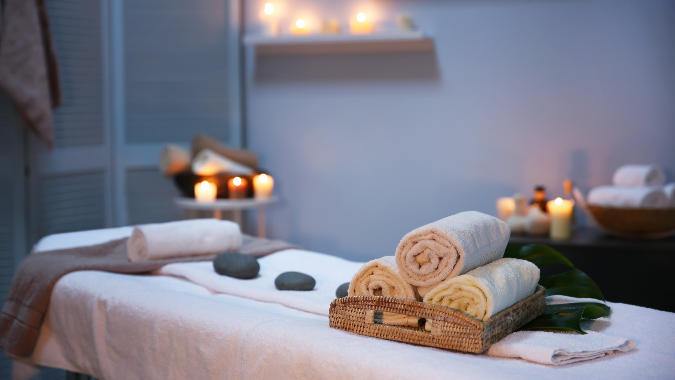 Spa setting with candles and essential oils